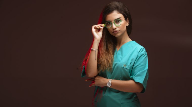 Young girl in eyeglasses looks positive online fellowship courses after mbbs, course for doctors, medical cert online,